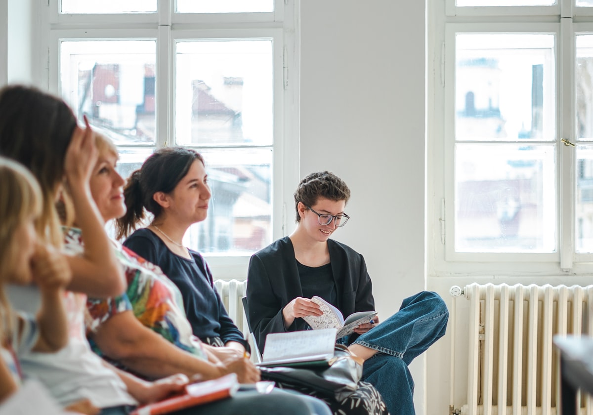 An engaged audience at a group wellness seminar (temporary stock photo)